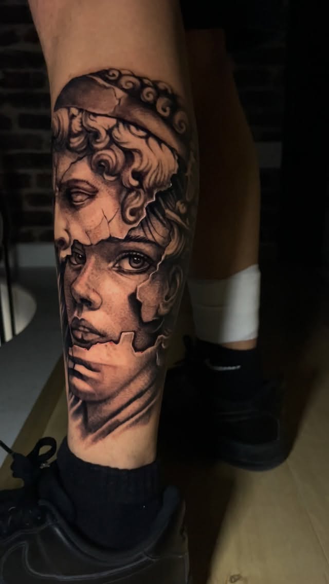Cracked Greek statue tattoo