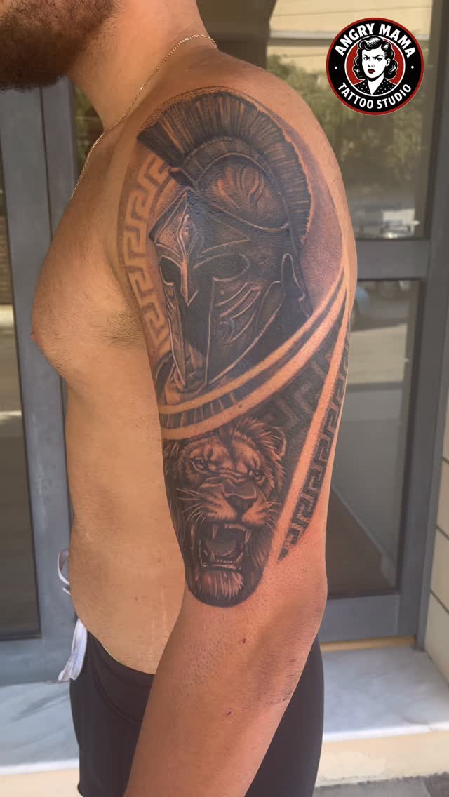 Custom Spartan and lion tattoo by Angry Mama Tattoo Studio